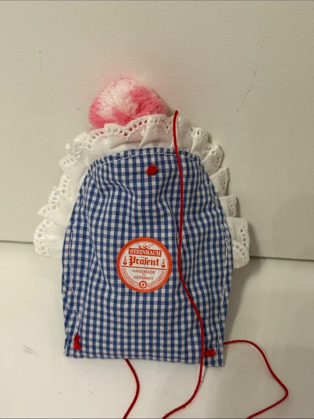 STEINBACH German Baby girl Ornament with bottle, pacifier & Blue Gingham Blanket